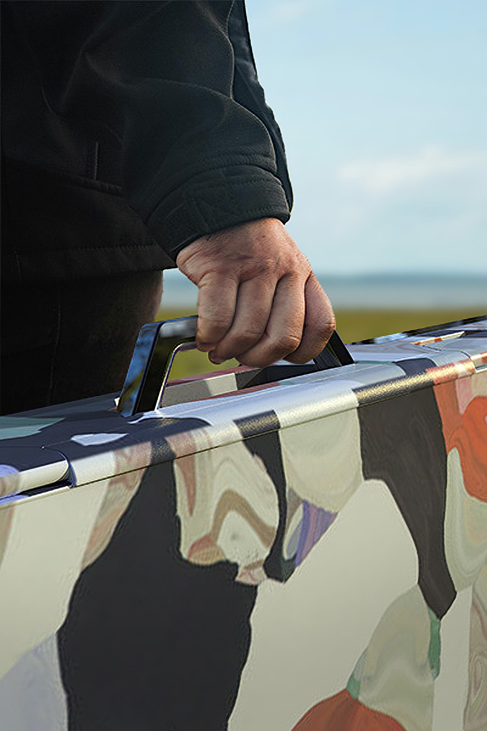 A closeup view of Rest being held by a handle